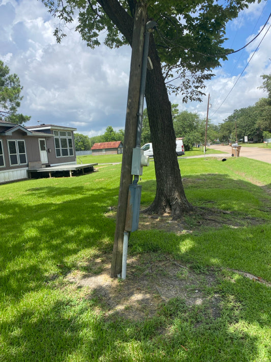 Broken and Leaning electric service pole